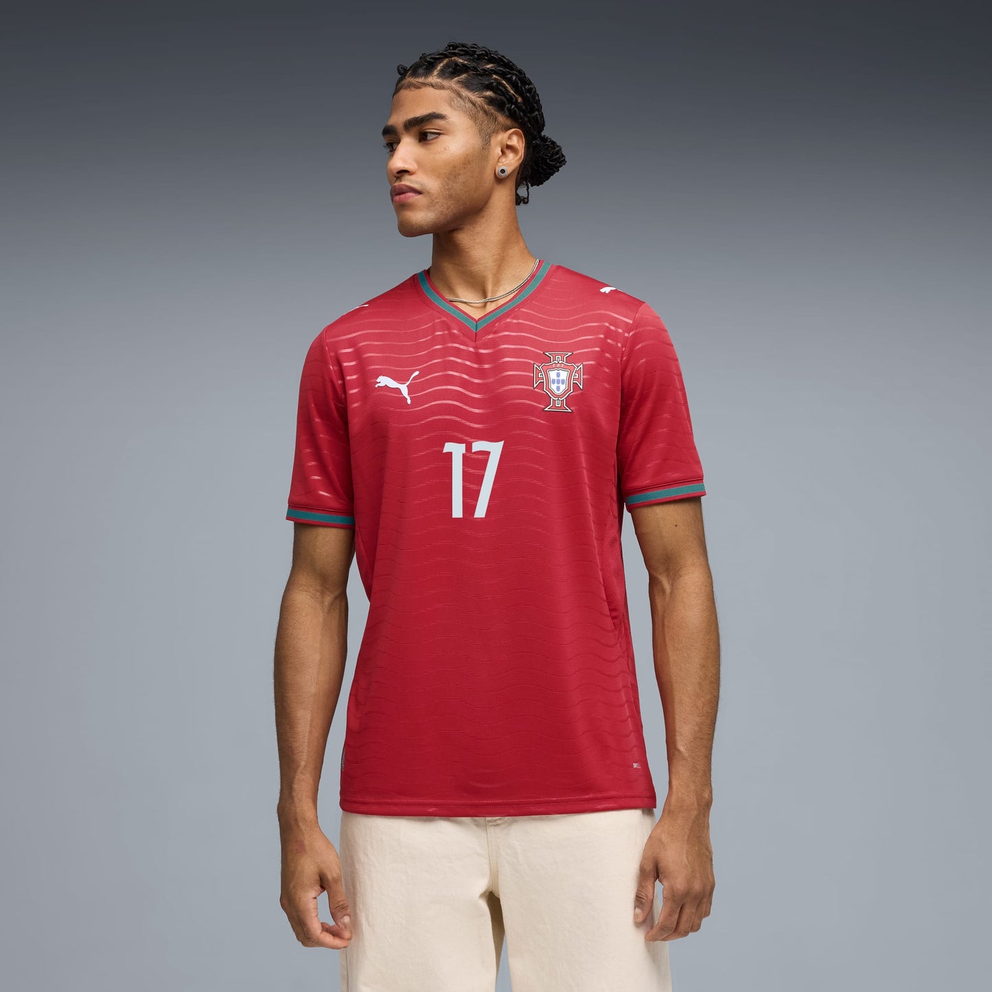 Person wearing a Portugal national team 2026 home soccer jersey with RAFA LEÃO #17 custom print