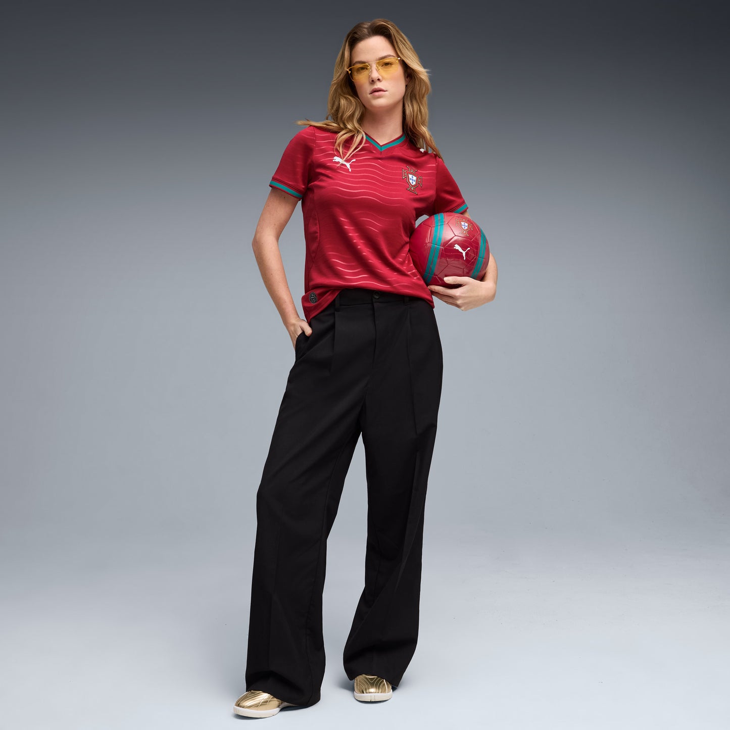 Person wearing a red Women's Portugal 2026 World Cup Home Stadium Replica Jersey