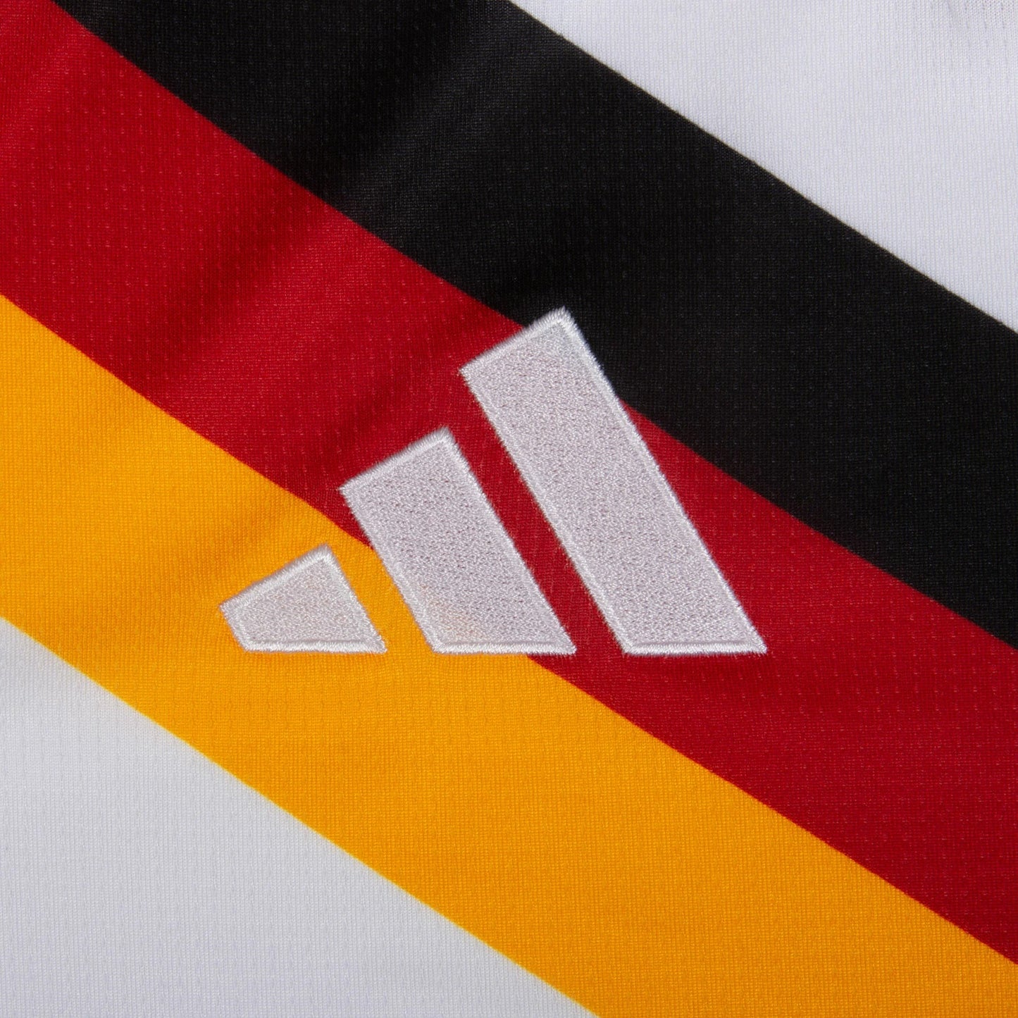 Close-up of Adidas logo on a geramny 2026 home jersey
