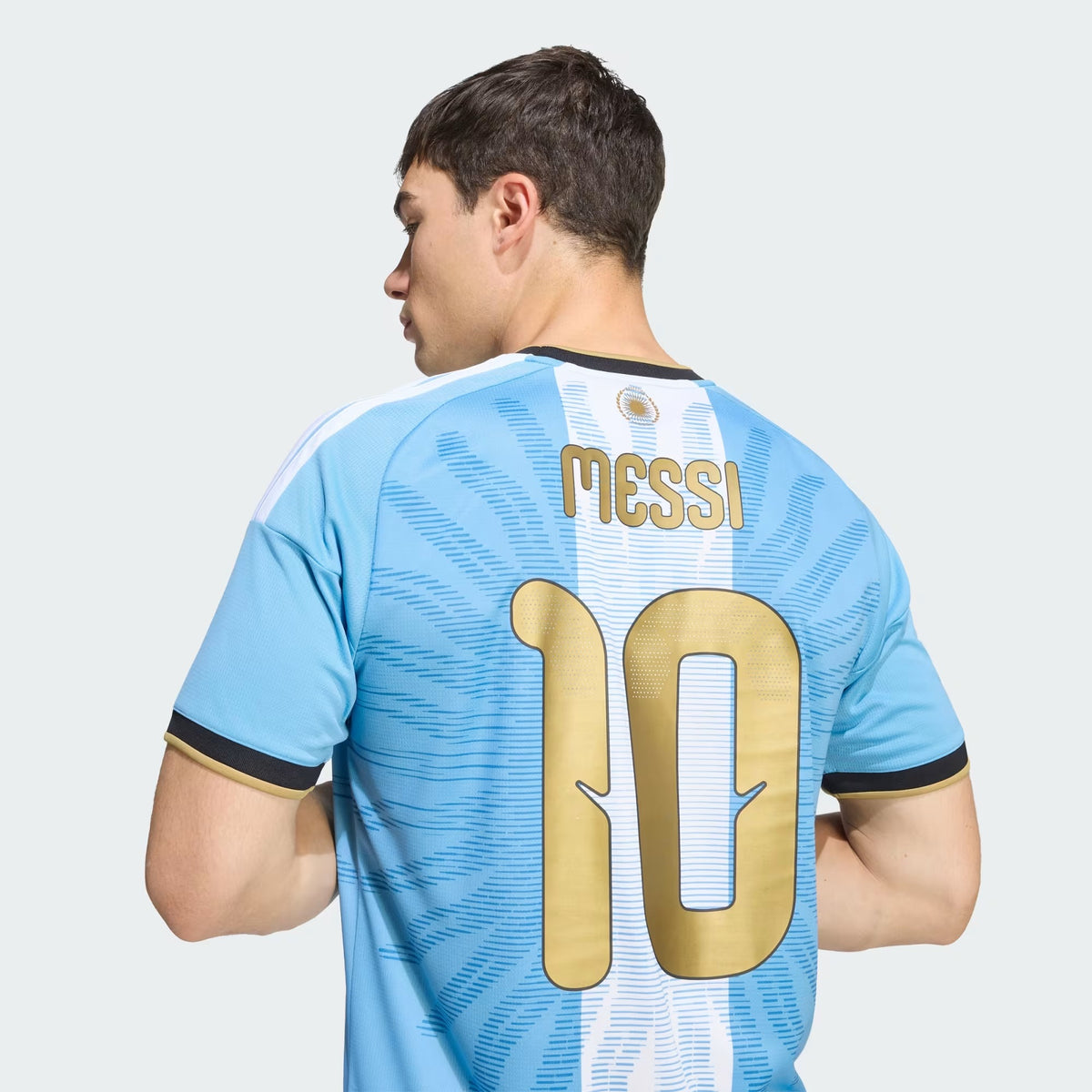 Man Wearing a Argentina national team AFA x Messi light blue replica football shirt with Lionel Messi name and number 10 printing