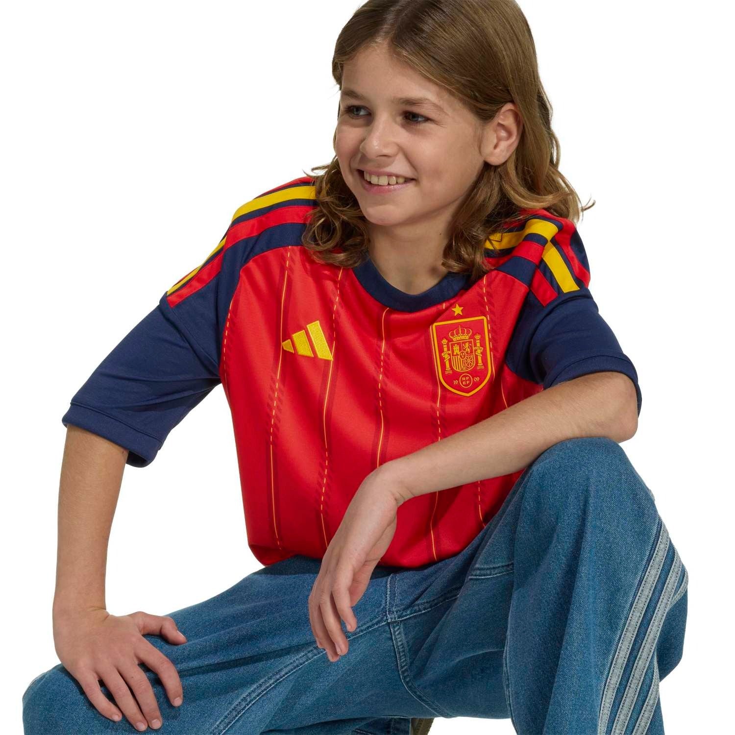 model wearing a Boy Wearing a Spain 2026 World Cup Home Kids Stadium Replica Jersey