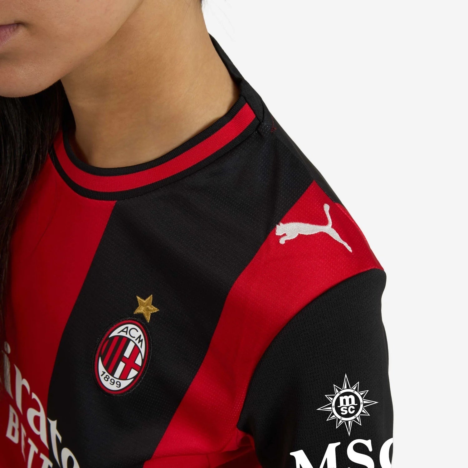 Detail of AC Milan 2026/27 women's home jersey shoulder and club crest