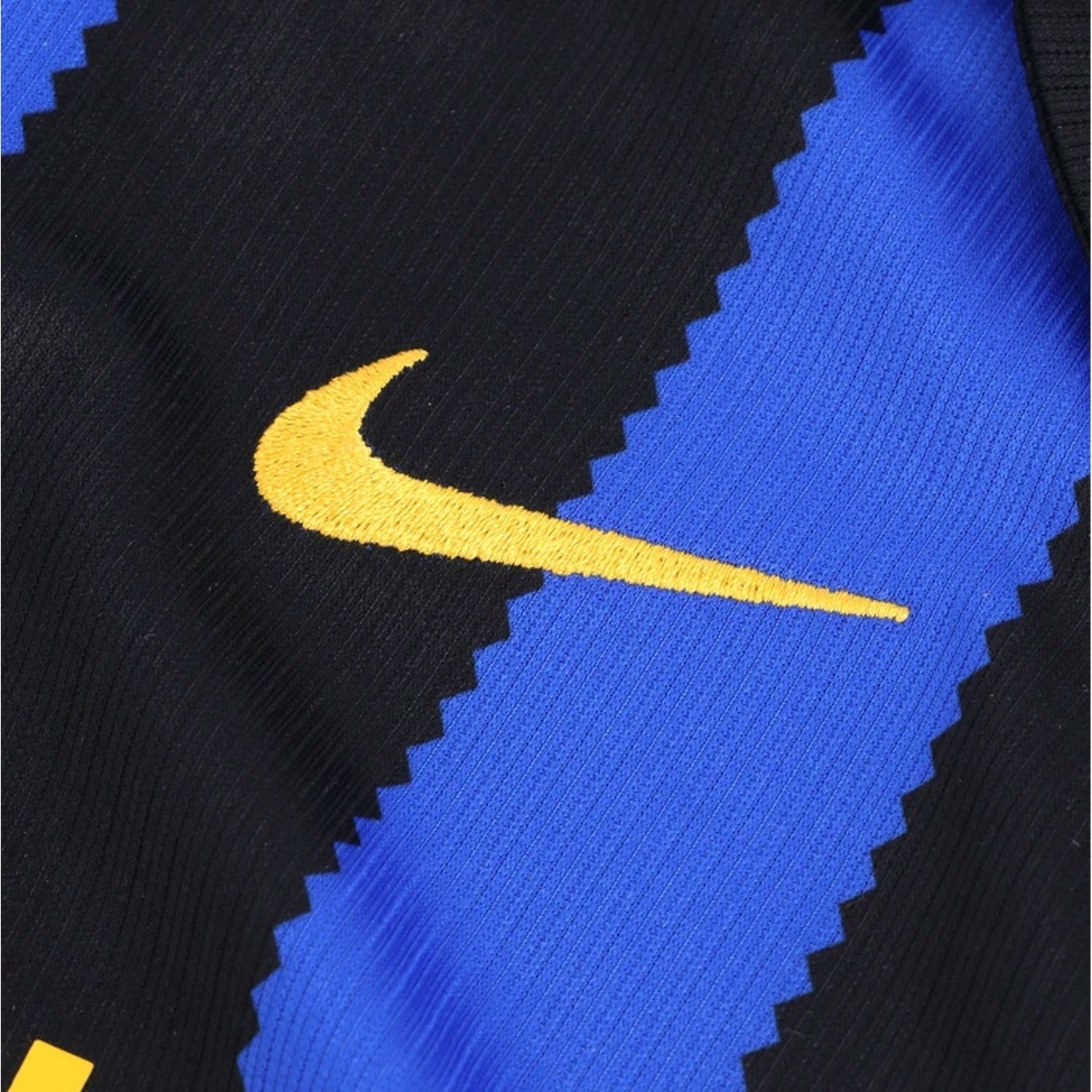 Close-up of embroidered Inter Milan club crest and Nike logo on kids kit