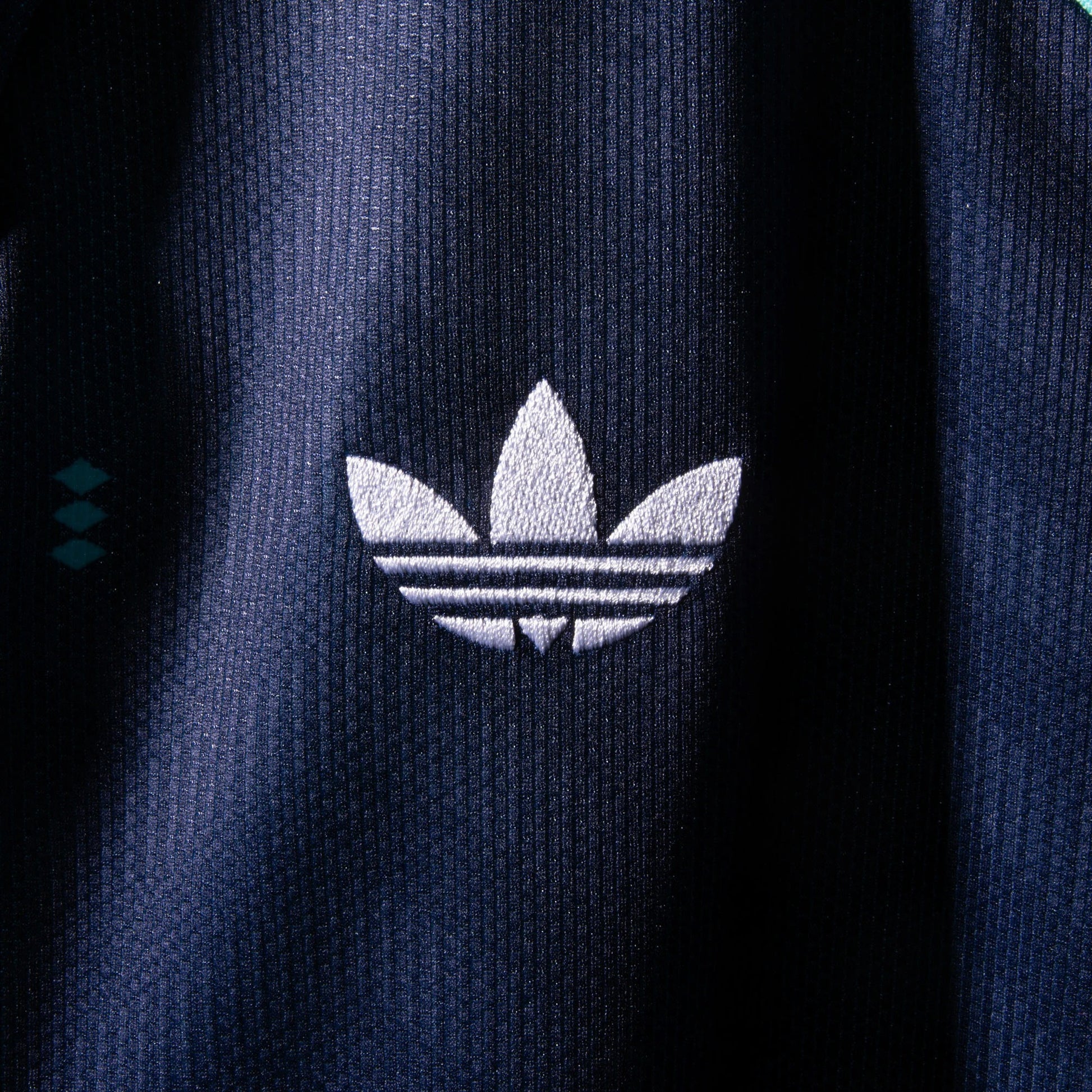 Close-up of Adidas logo on a germany away jersey