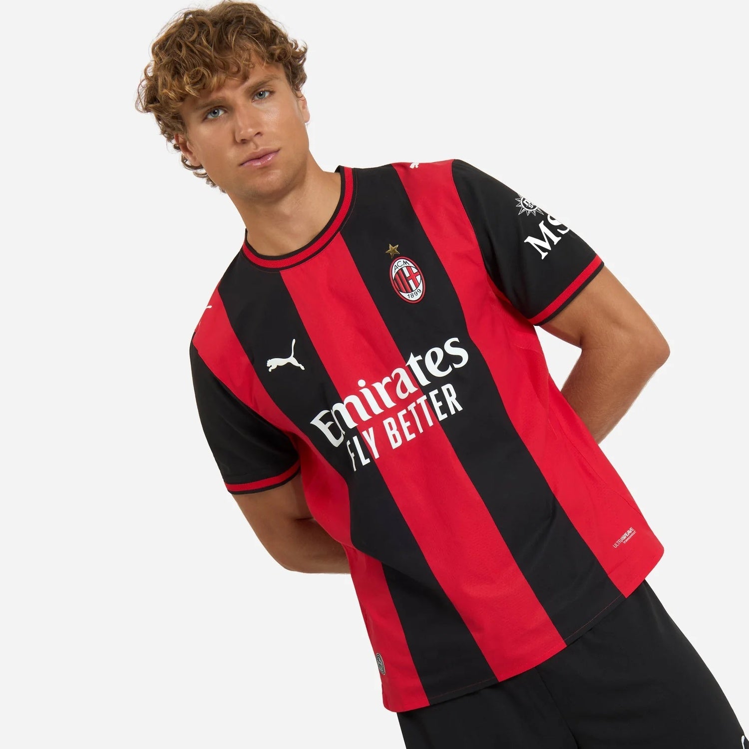 Model wearing AC Milan 2026/27 home soccer jersey