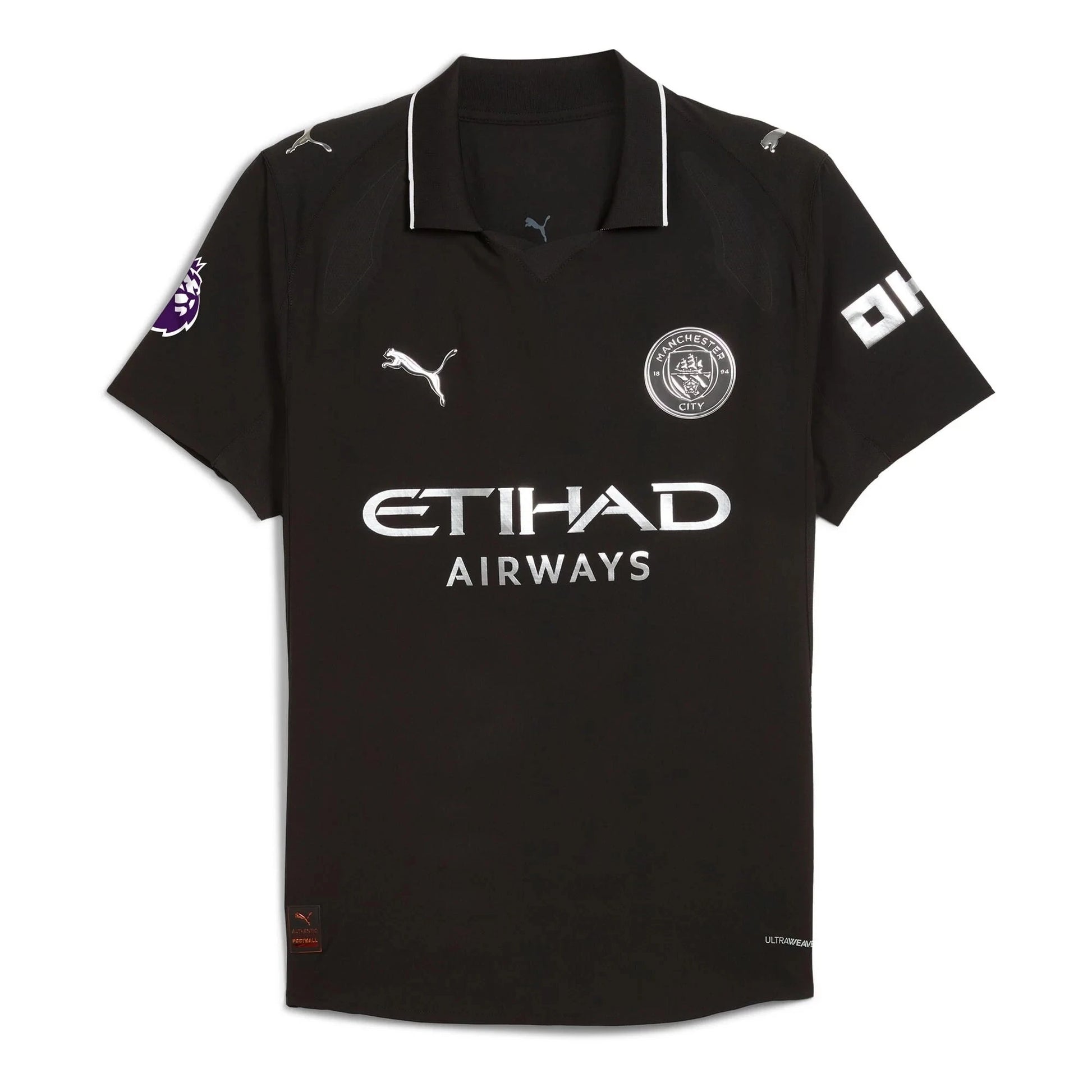 Flat lay of Manchester City 2025/26 away replica jersey front showing club crest and maroon sponsor details
