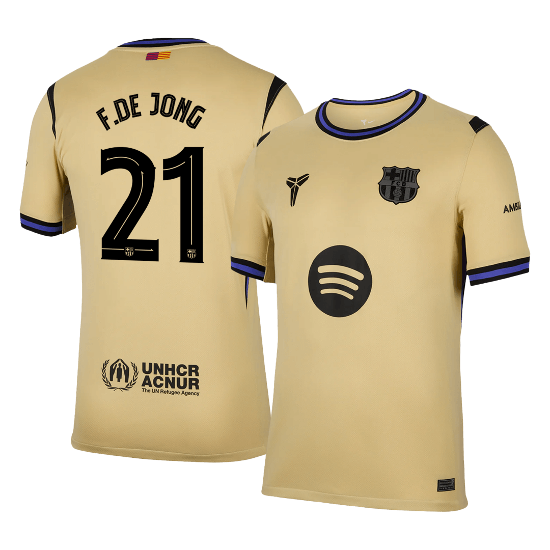 Beige sports jersey with black text and logos on a clear background
