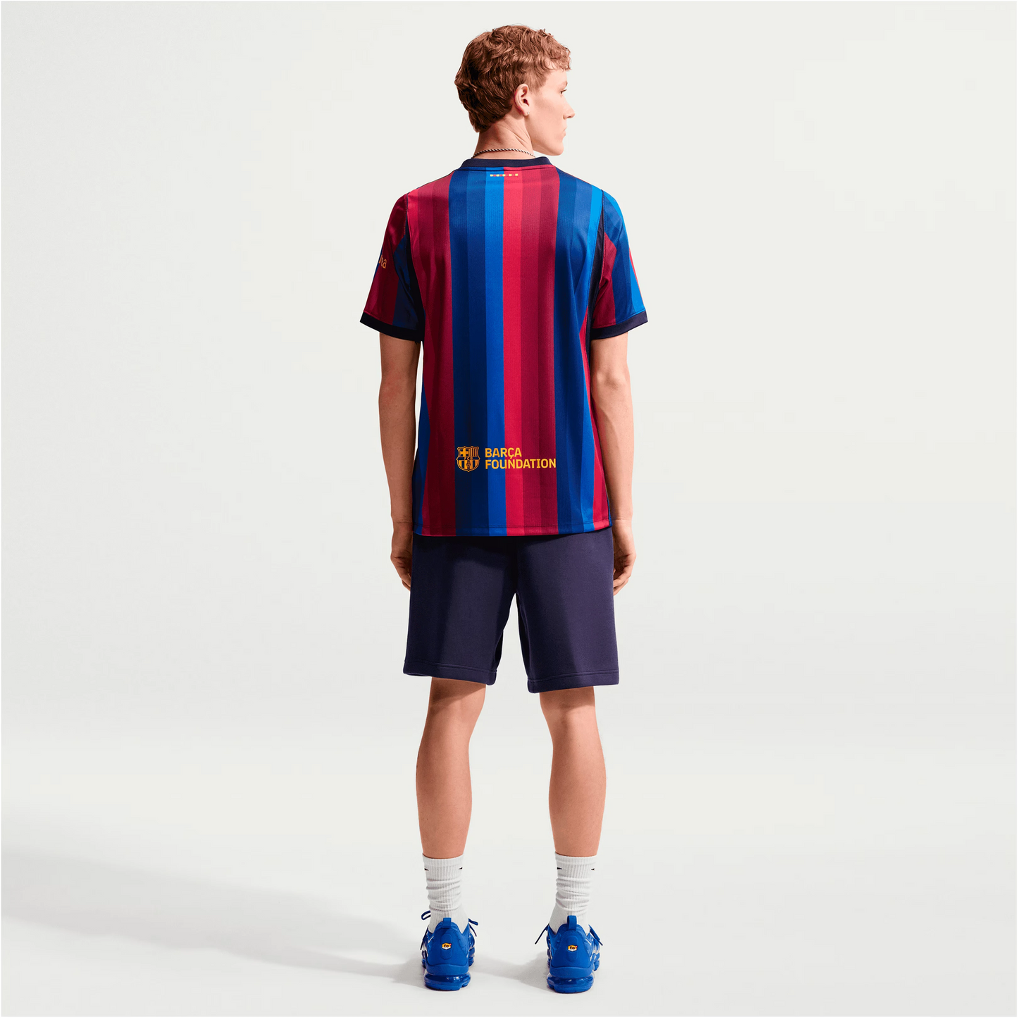 Man Wearing A Barcelona 2026/27 Home Stadium Replica Jersey Back View