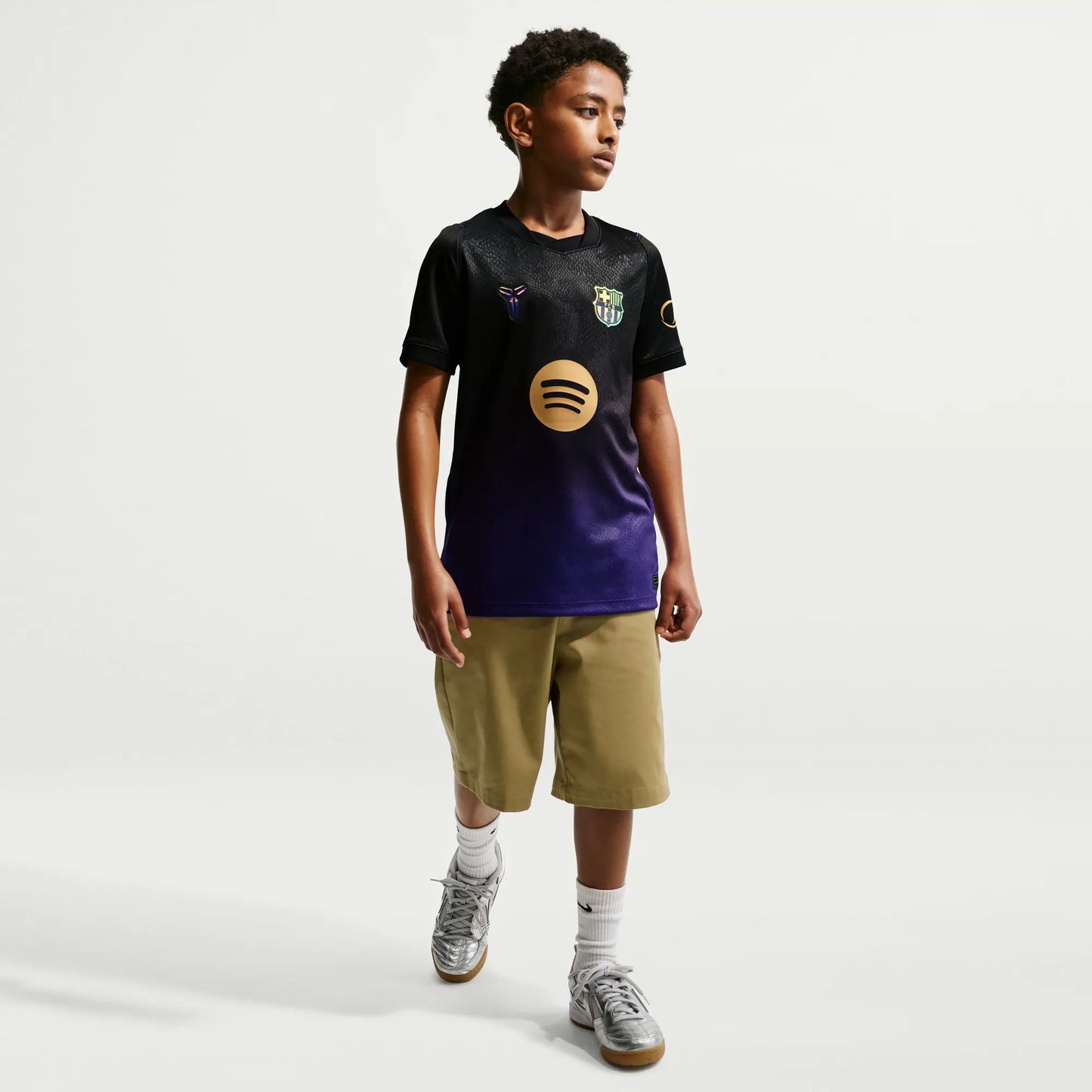 A child model wearing a Barcelona Youth 2026_27 Away Stadium Replica Custom Jersey