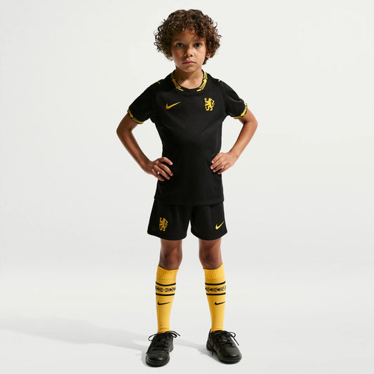 A young boy modeling a black Nike Chelsea Preschool 2026/27 Away Stadium Replica Kit Set 