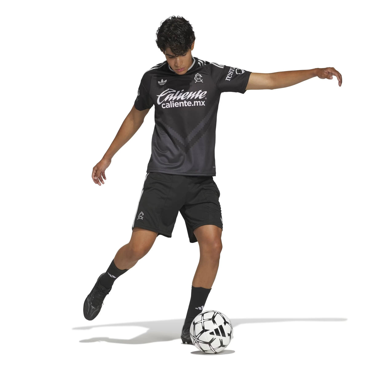 A soccer player in a Club America 2026-2027 away black replica football shirt