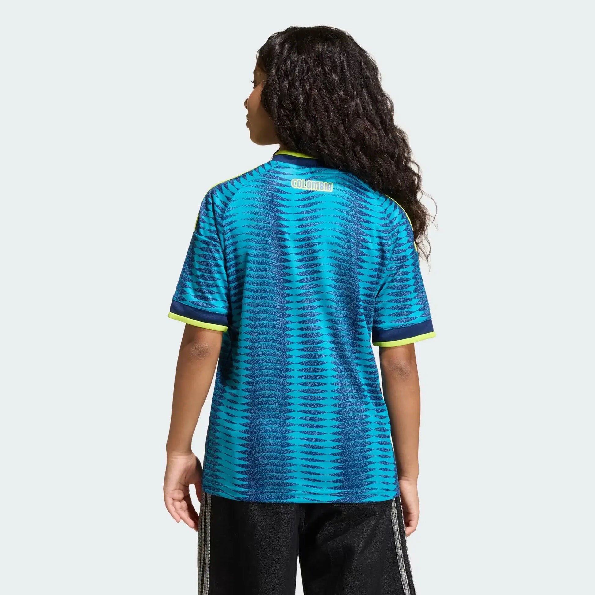 Back View Of A Girl Wearing Blue Colombia 2026 Away Jersey