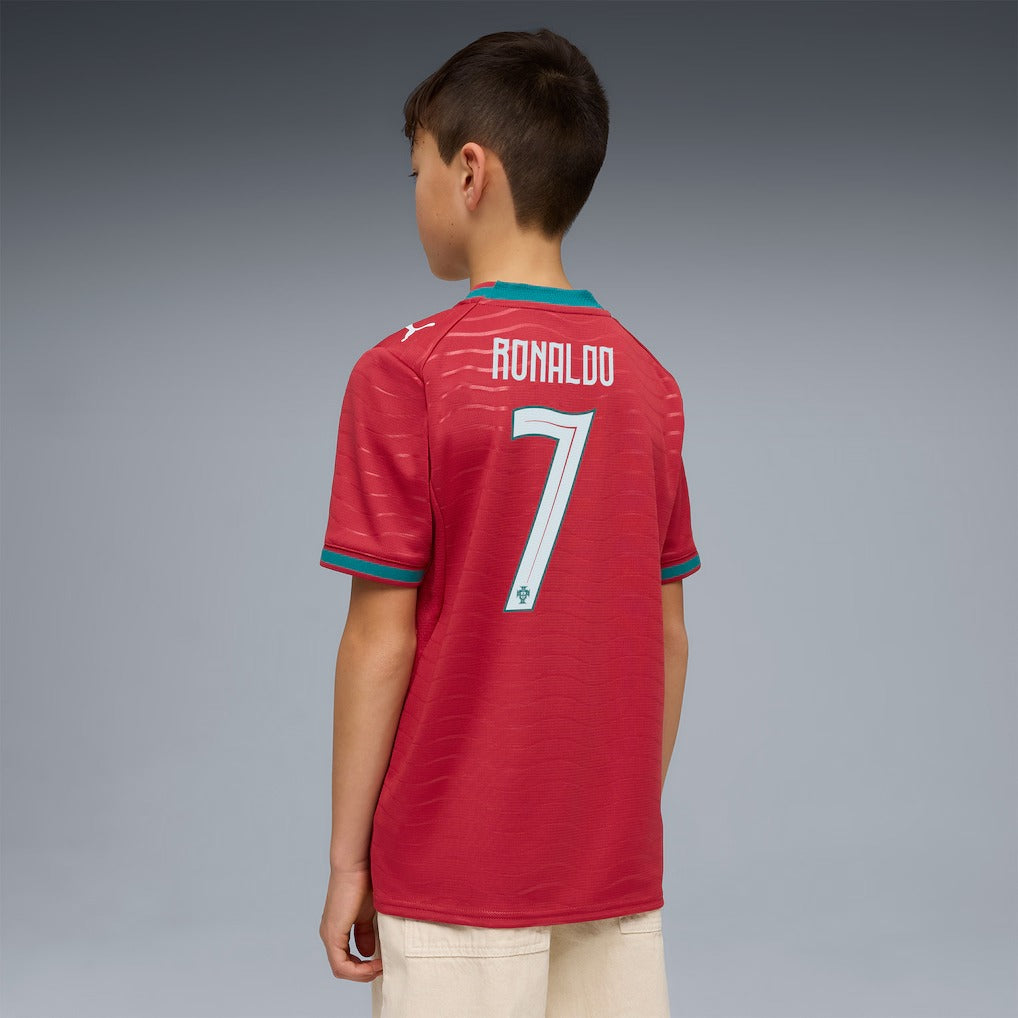 boy wearing a red girl wearing a red Portugal 2026 World Cup home Kids Stadium Replica Jersey - Ronaldo #7
