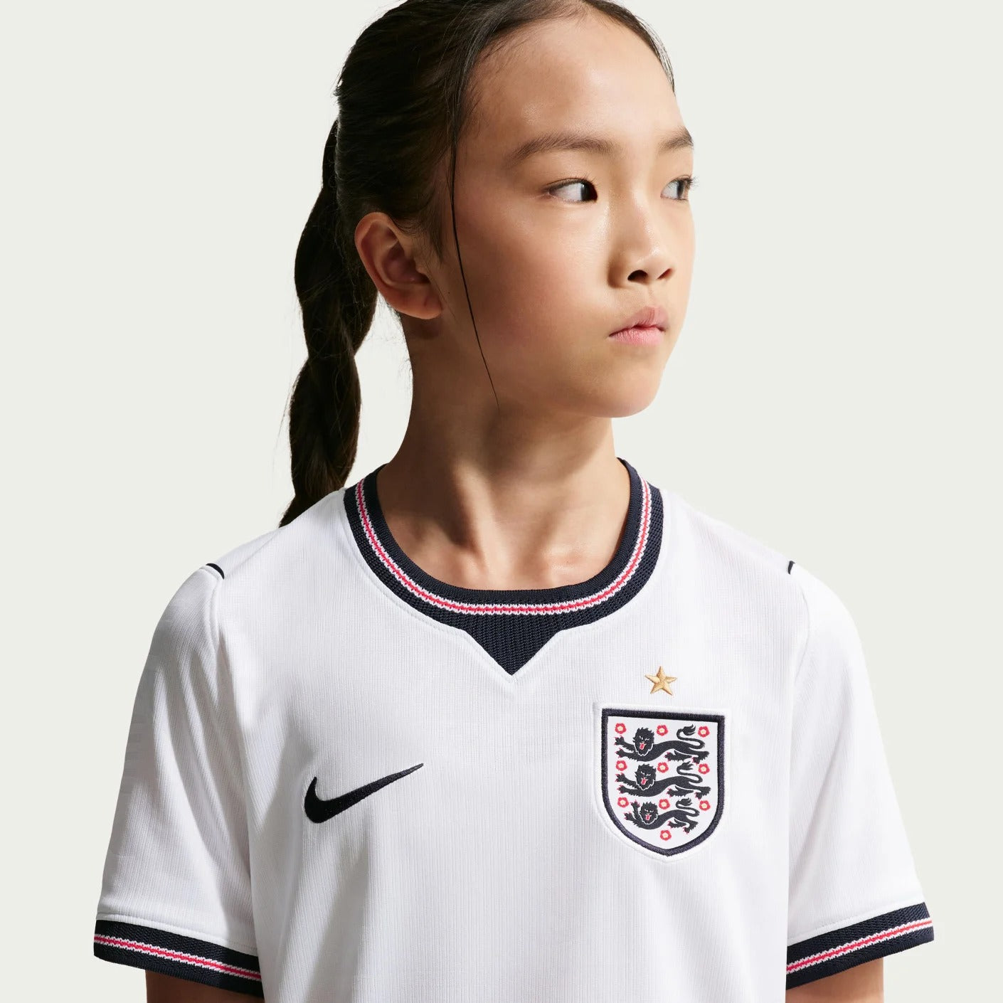 Girl wearing an England 2026 World Cup National Team Stadium Home Kids Jersey