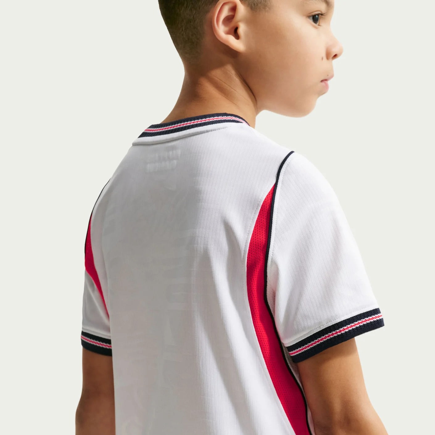 Boy wearing an England 2026 World Cup National Team Stadium Home Kids Jersey back view