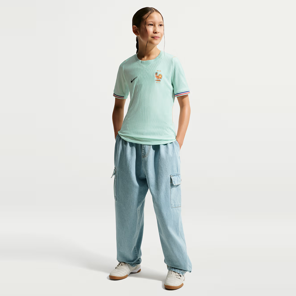 girl wearing a France 2026 World Cup Away Kids Stadium Replica Kit