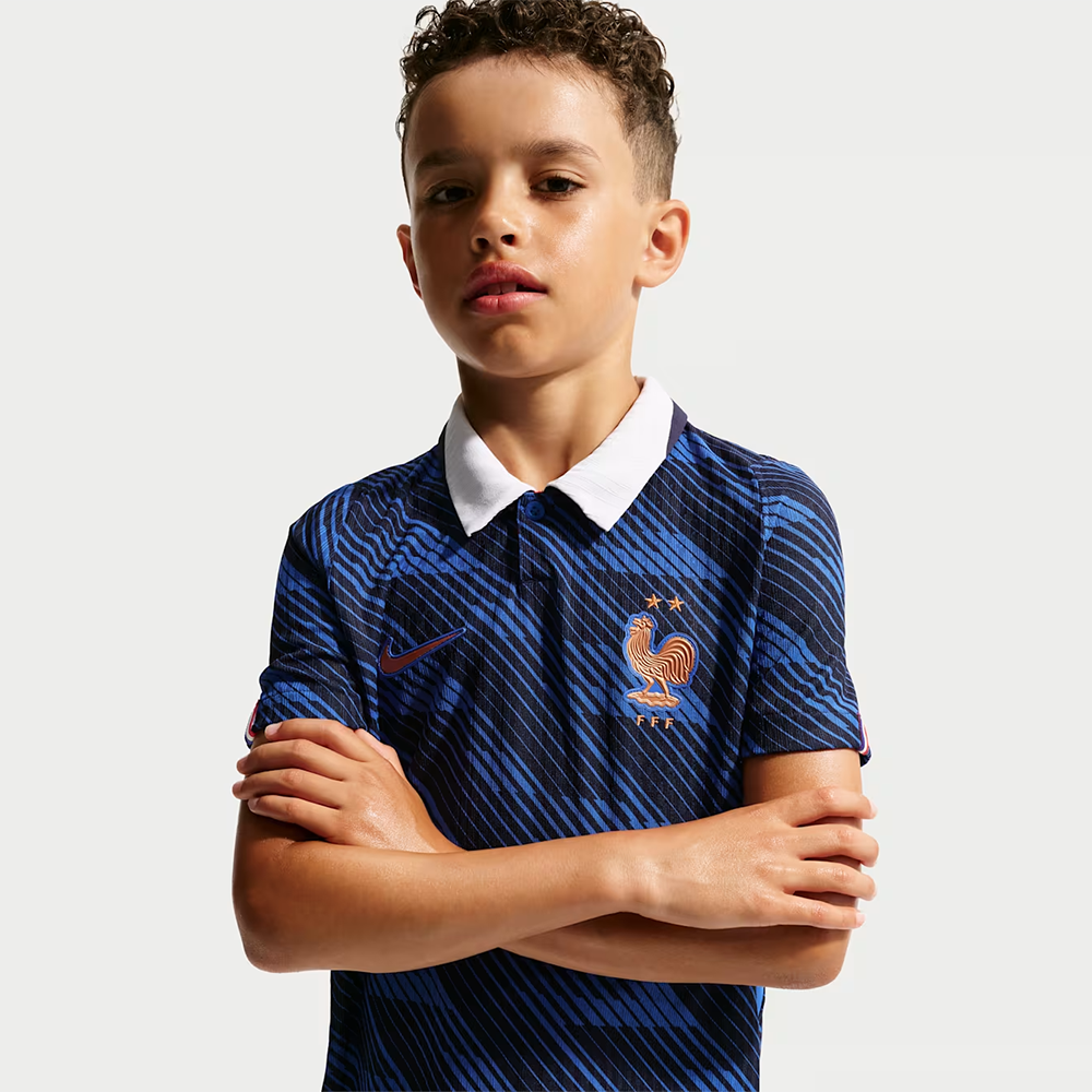 boy wearing a France 2026 World Cup Home Kids Stadium Replica Kit