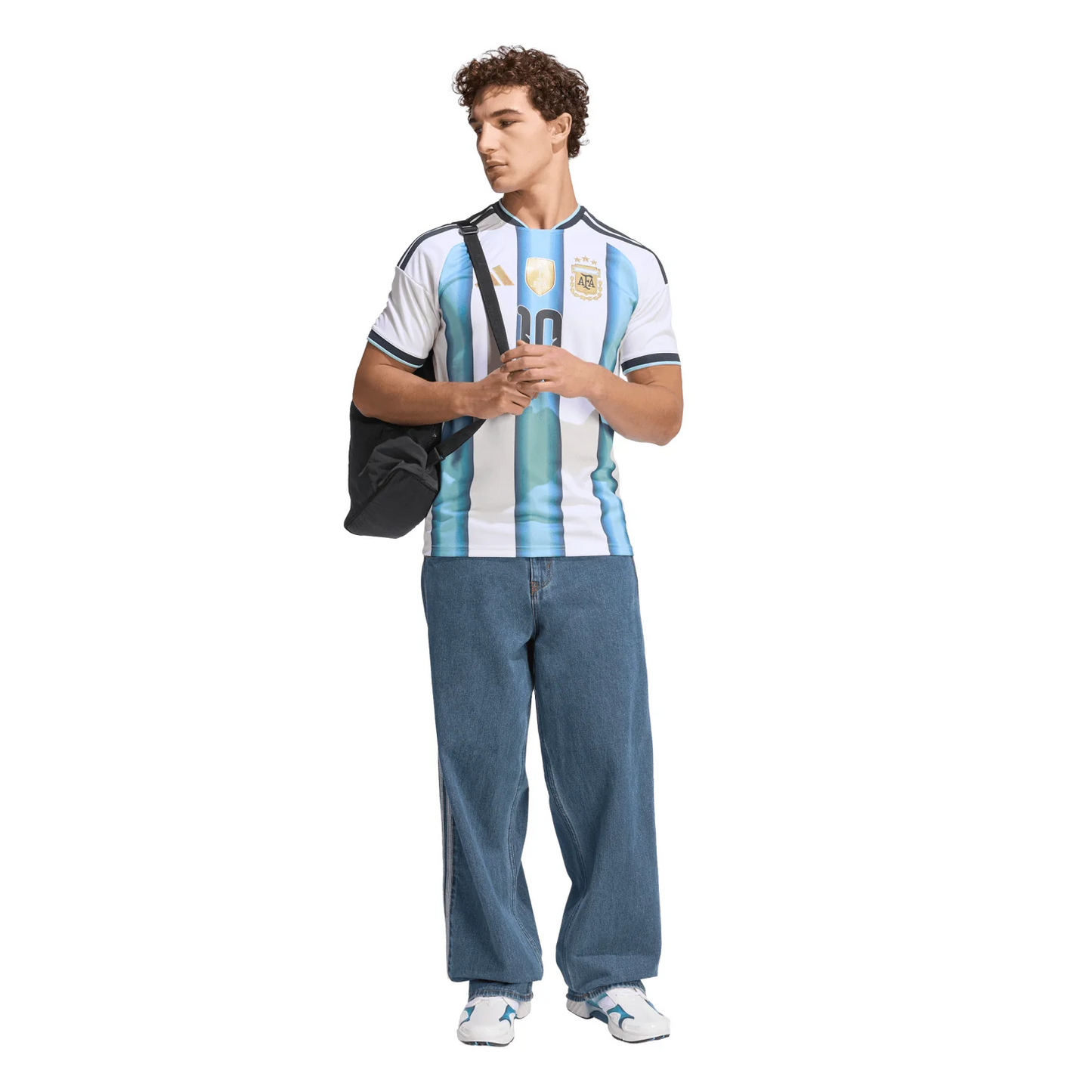 Person wearing an Argentina soccer jersey with blue pants on a white background