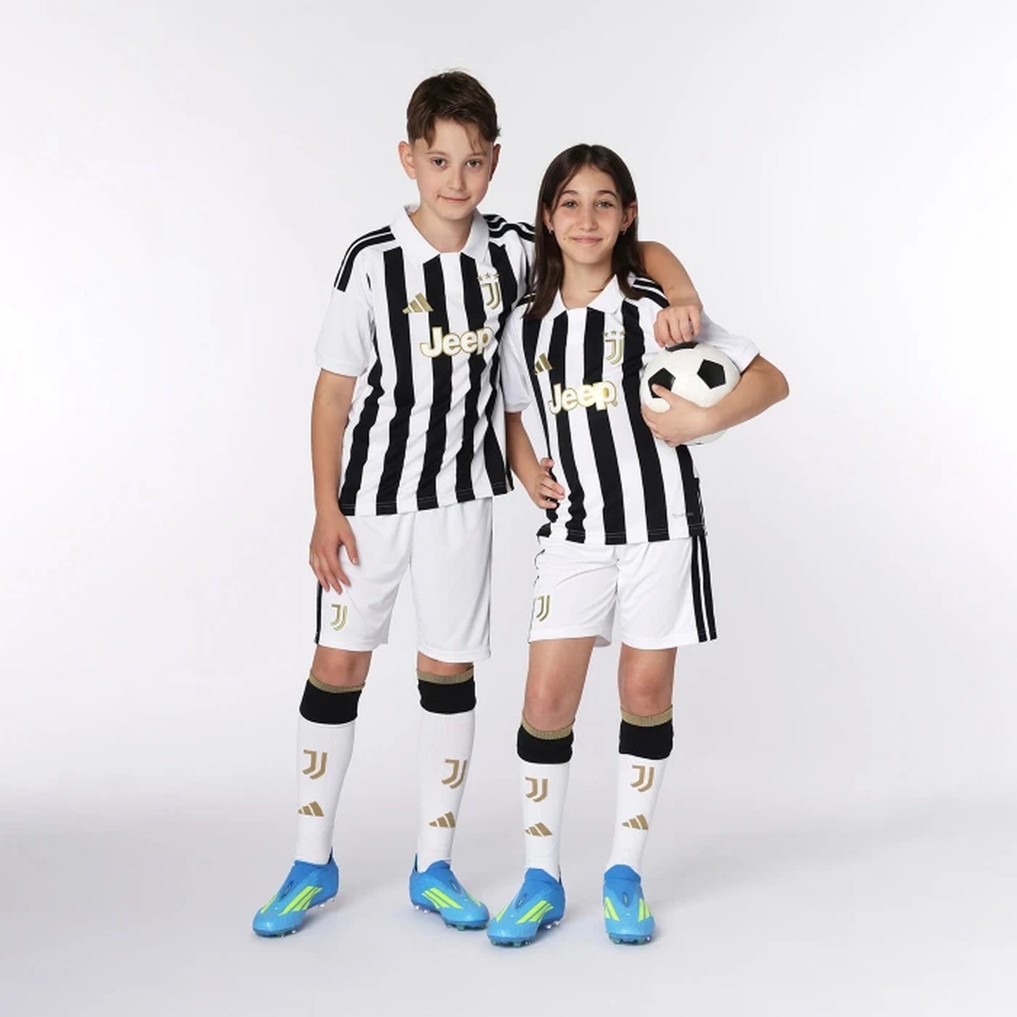 Kids wearing Juventus 2026/27 home soccer kit outfit