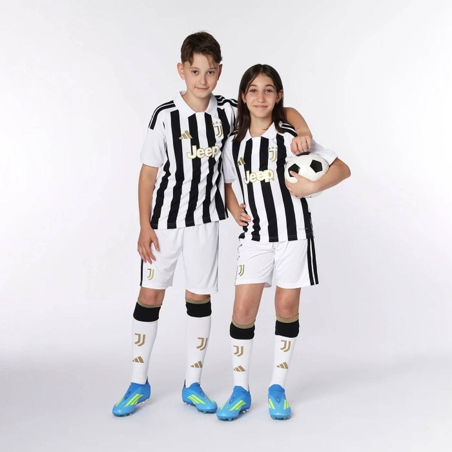 Kids wearing Juventus 2026/27 home soccer kit outfit