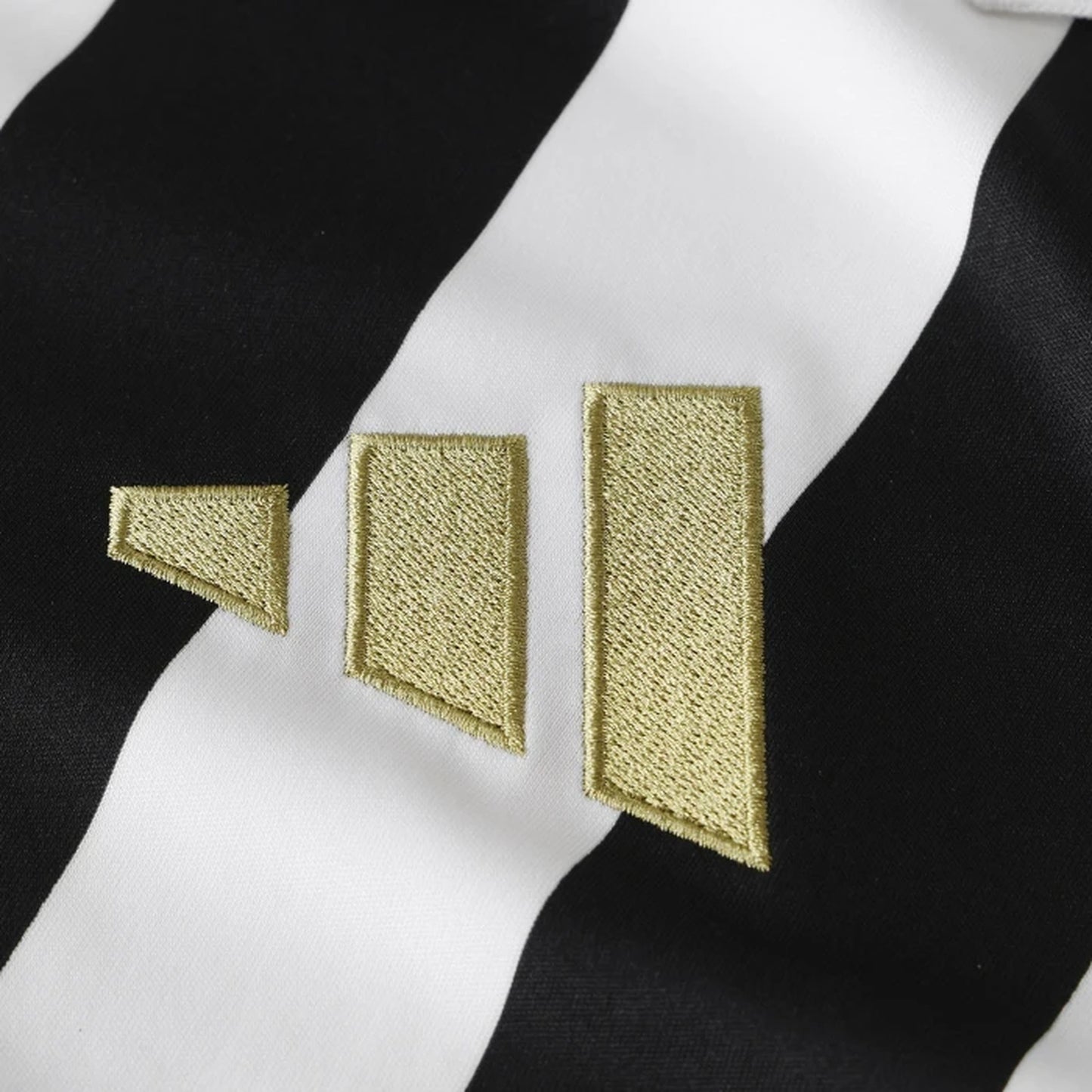 Close-up of embroidered Adidas logo on Juventus 2026/27 women's home jersey