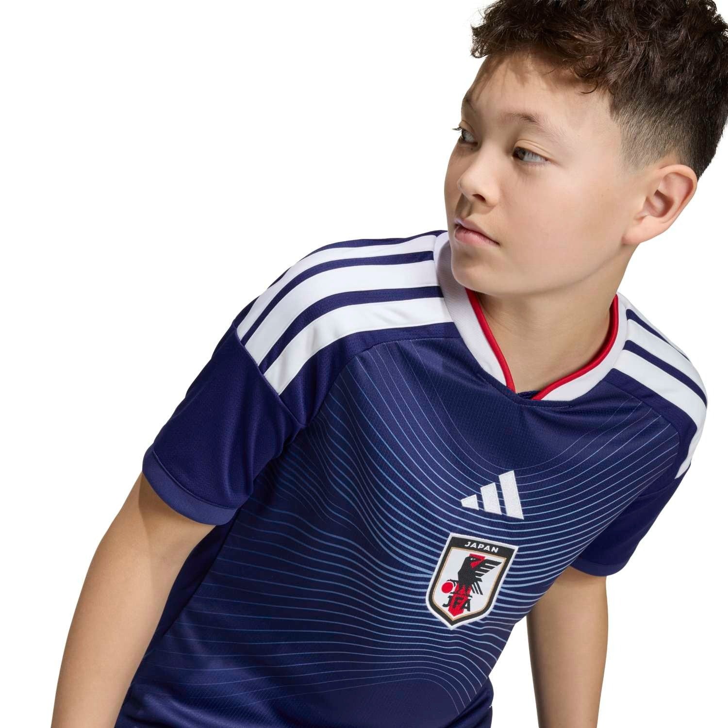 chest details of Boy wearing Kids Japan 2026 World Cup Home stadium replica jersey