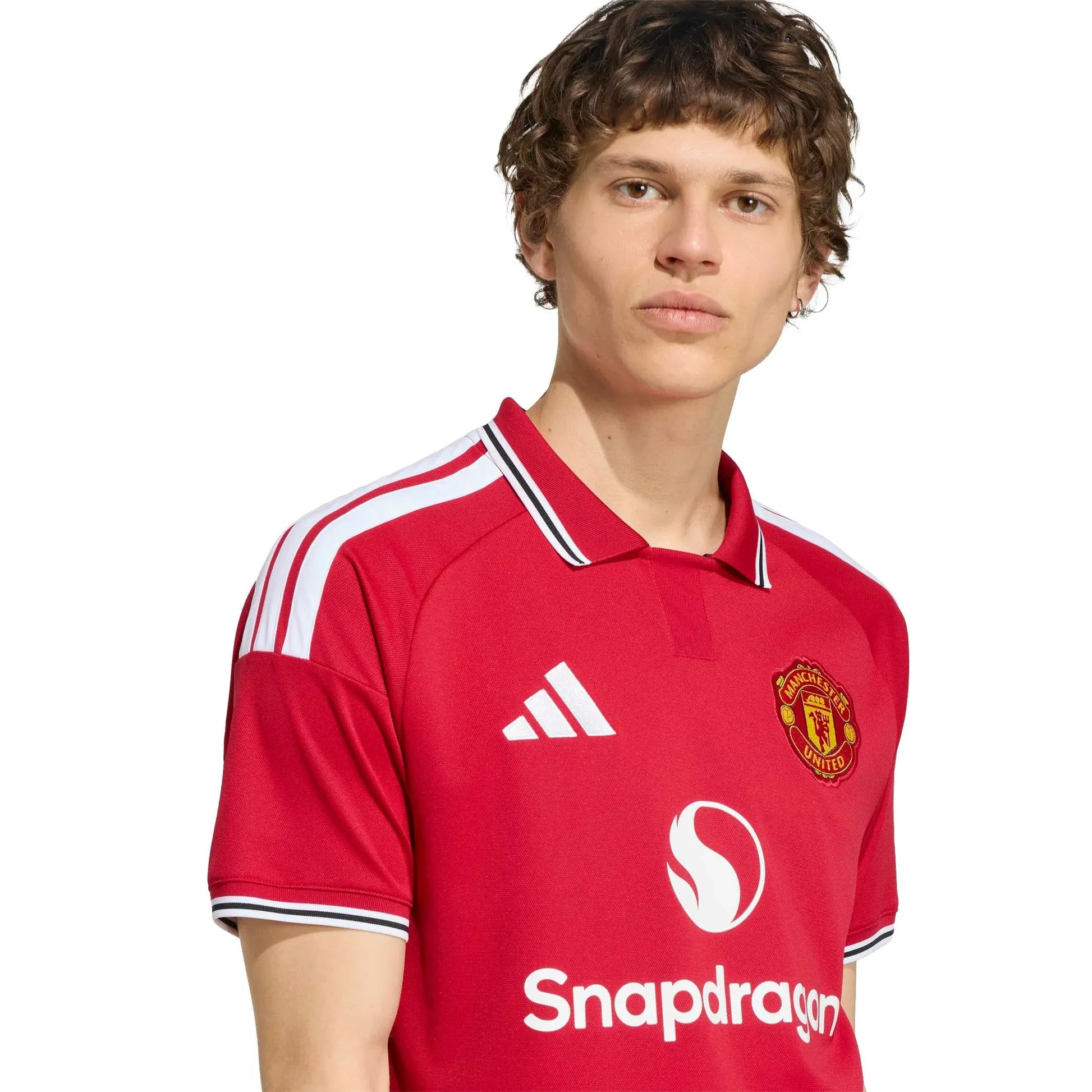 Person wearing a red 2026/27 Manchester united home jersey with visible branding on a white background