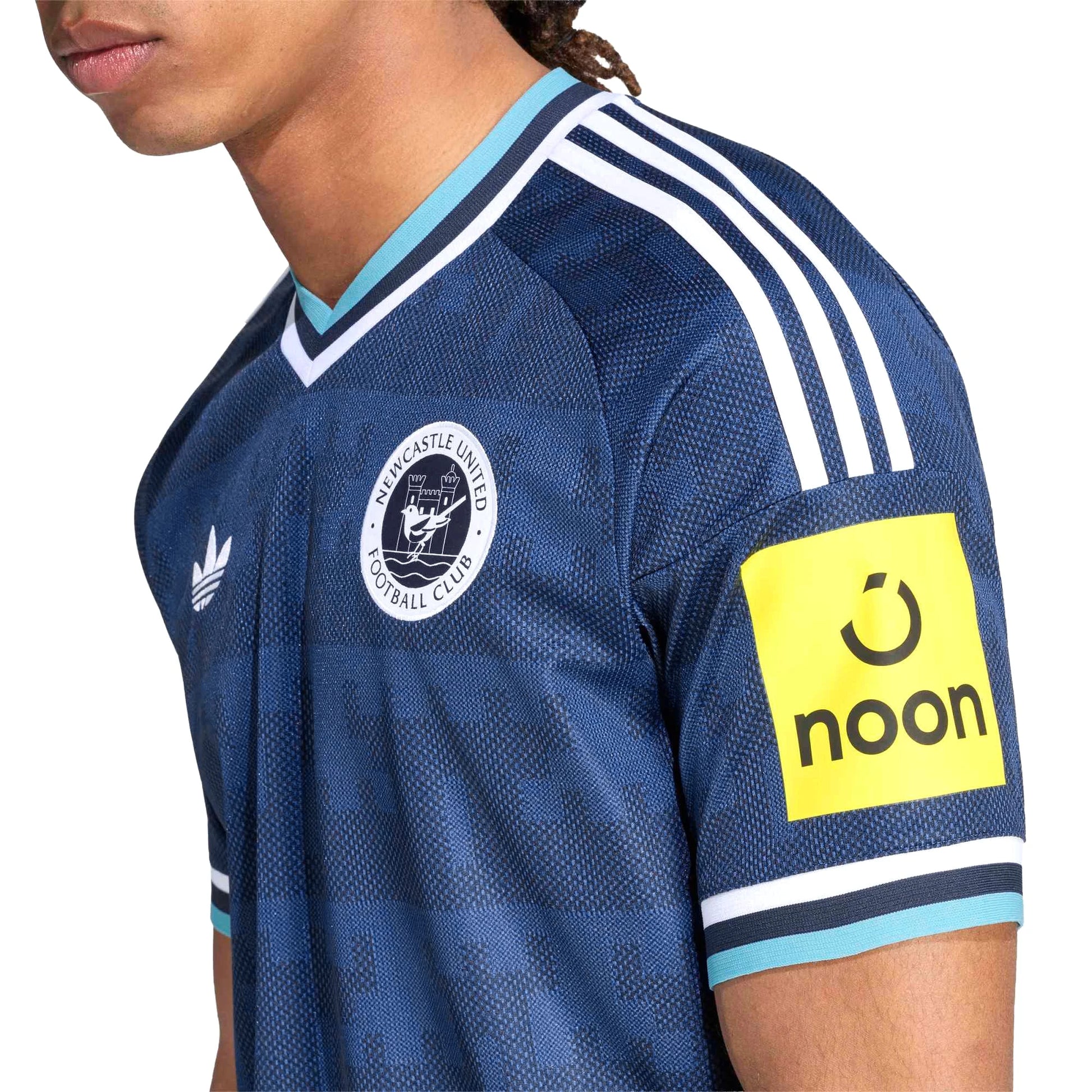 Side View Of A Man Wear A Newcastle United 2026 27 Home Jersey