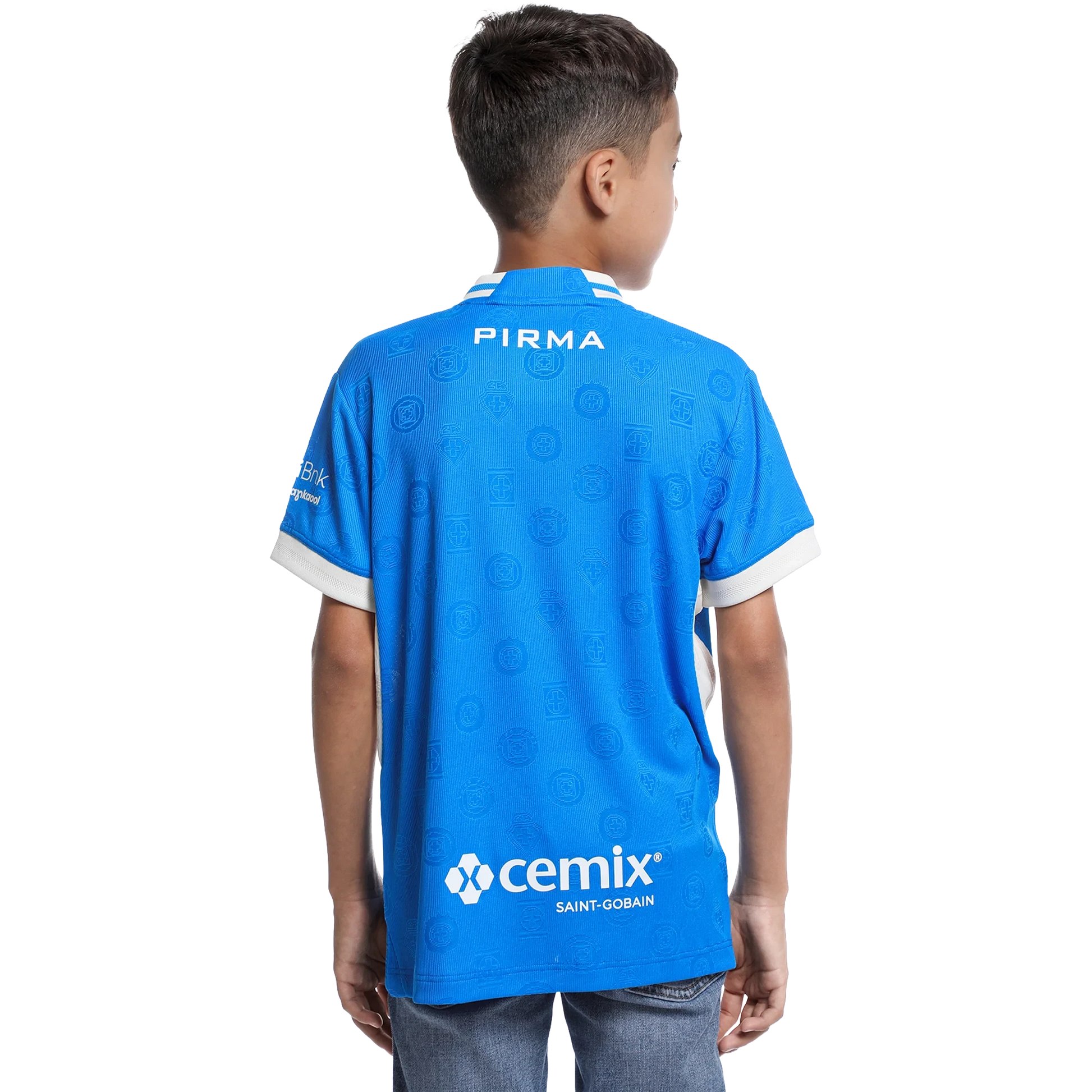 A child viewed from the back wearing a bright blue soccer jersey with white trim, featuring 'PIRMA' on the collar and 'cemix SAINT-GOBAIN' on the lower back.