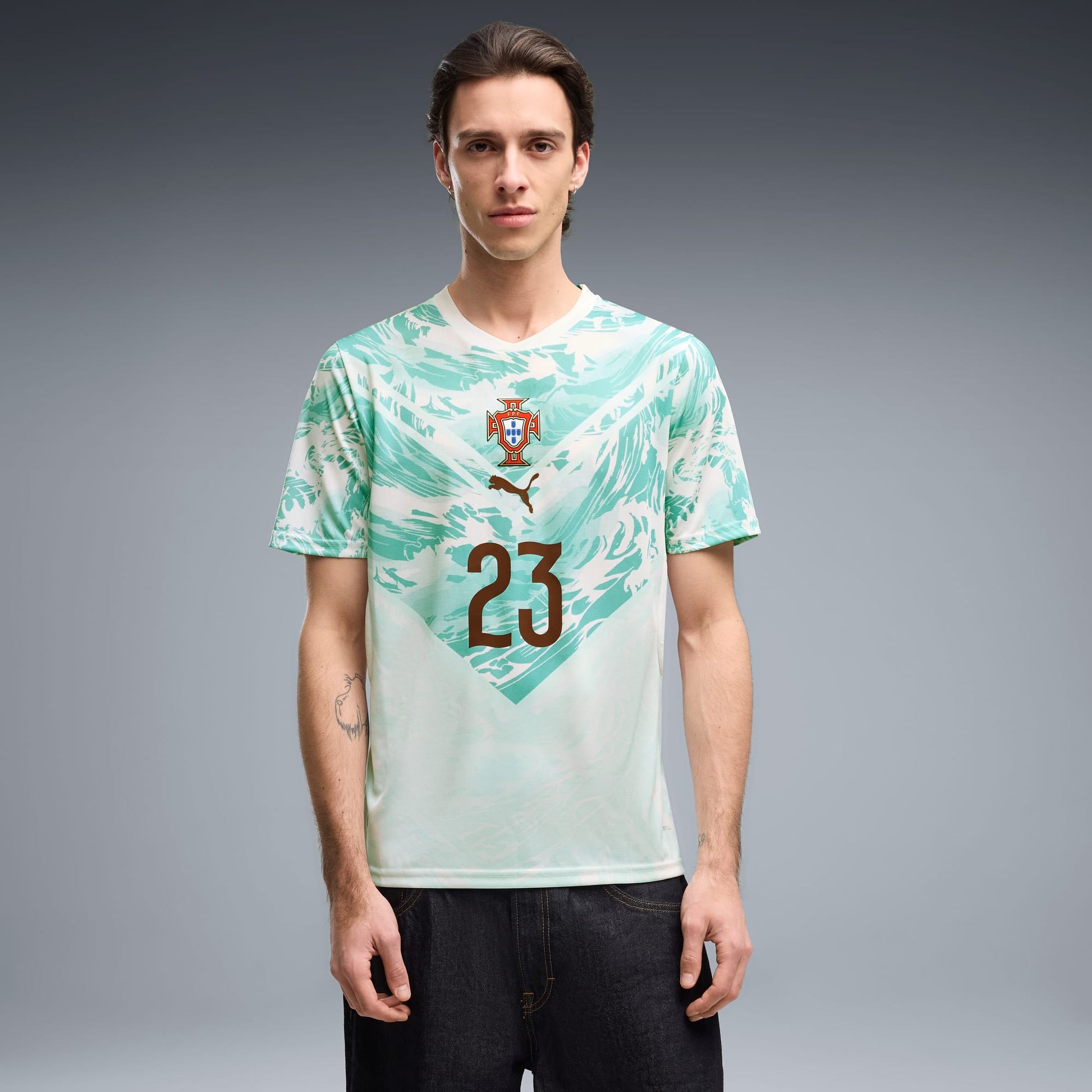 man wearing a Portugal 2026 World Cup Away Stadium Replica Jersey - Vitinha #23
