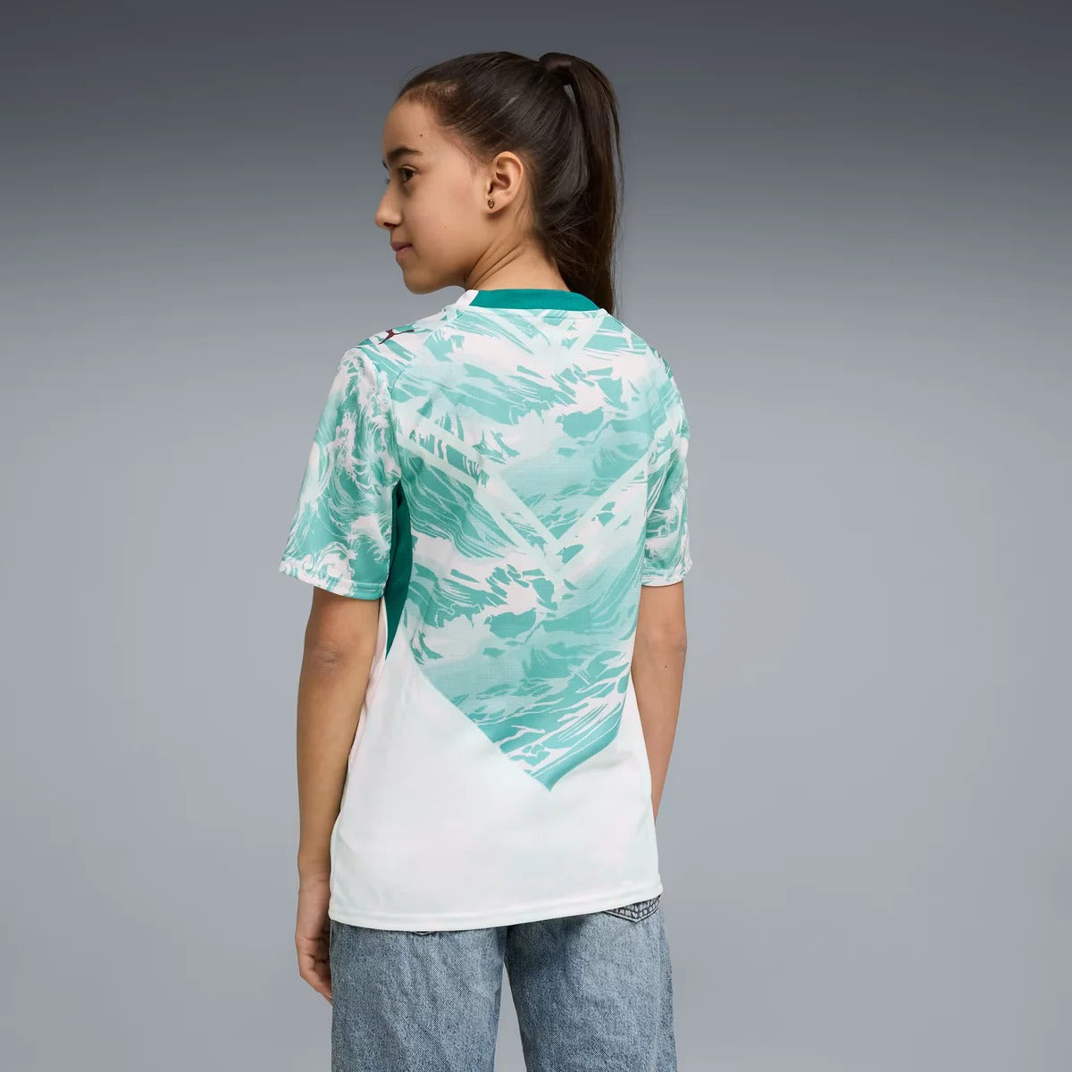 back view of a girl wearing a Portugal 2026 World Cup Away Kids Stadium Replica Jersey