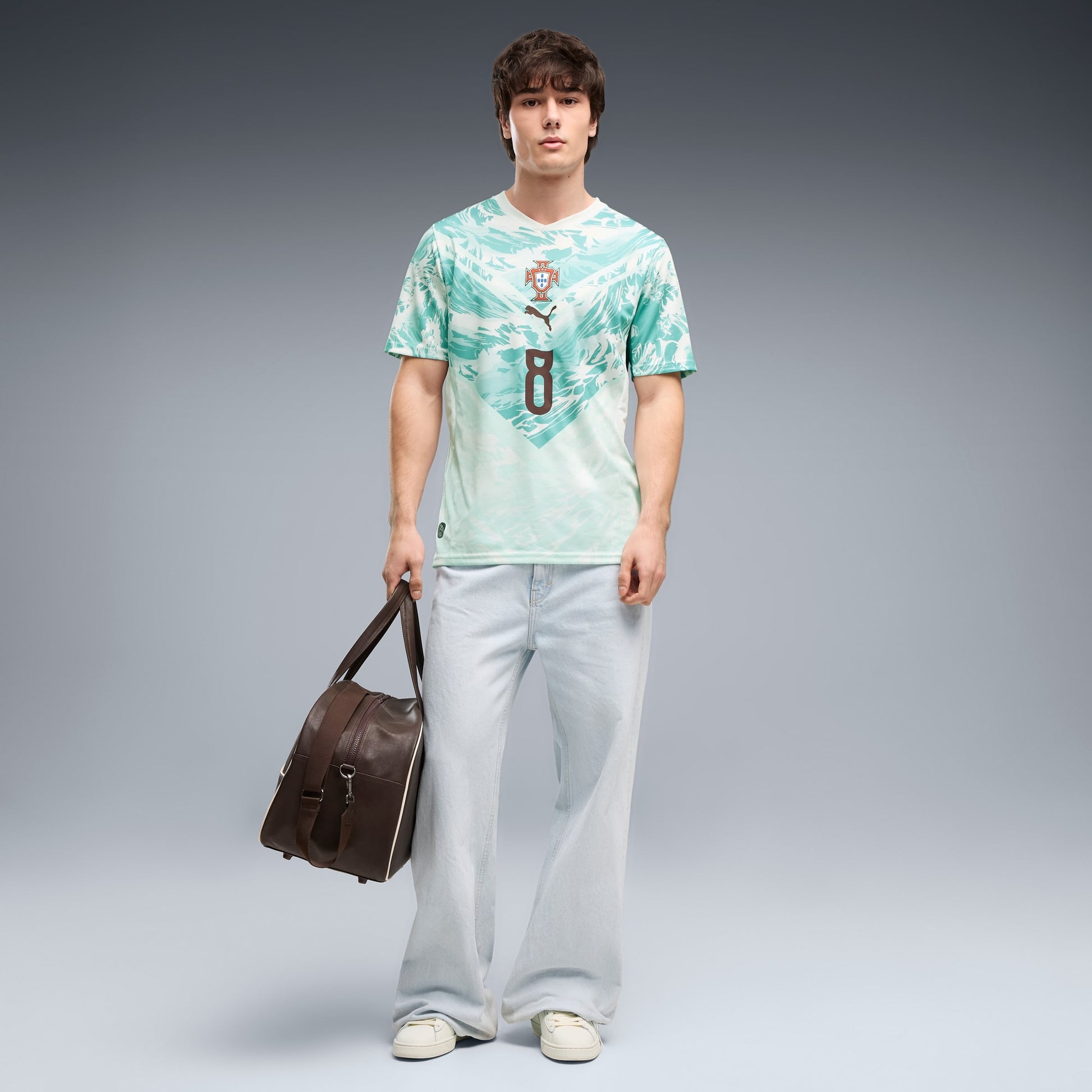 man wearing a Portugal national team 2026 away stadium jersey with RAFA LEÃO #17 printing