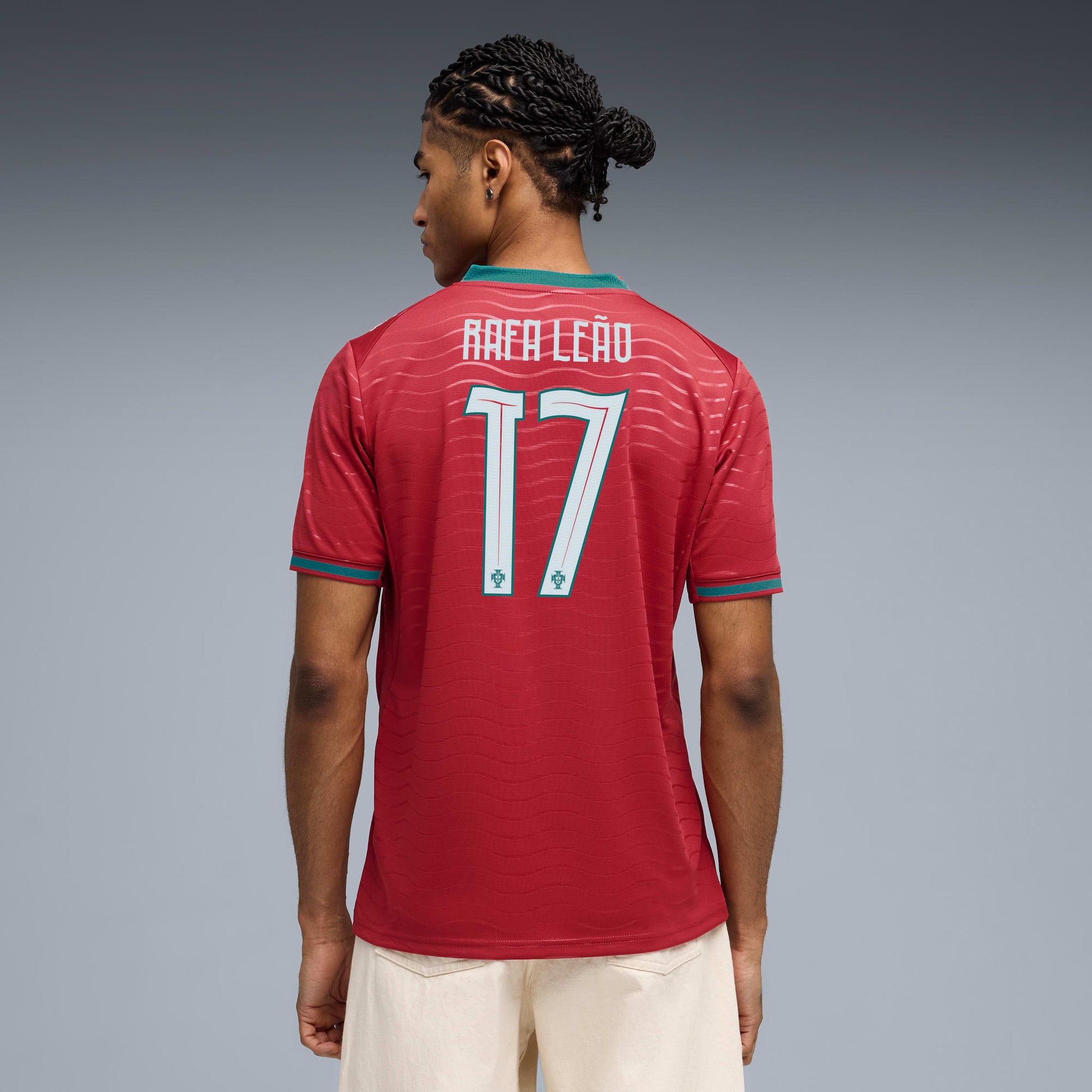 Man wearing A Red Portugal Rafa Leao 17 jersey
