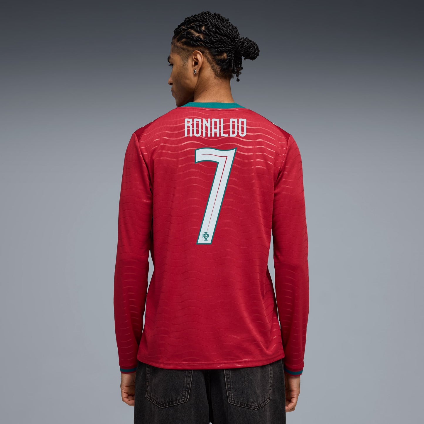 Person wearing a portugal 2026 long sleeve home stadium with ronaldo 7 printing back view