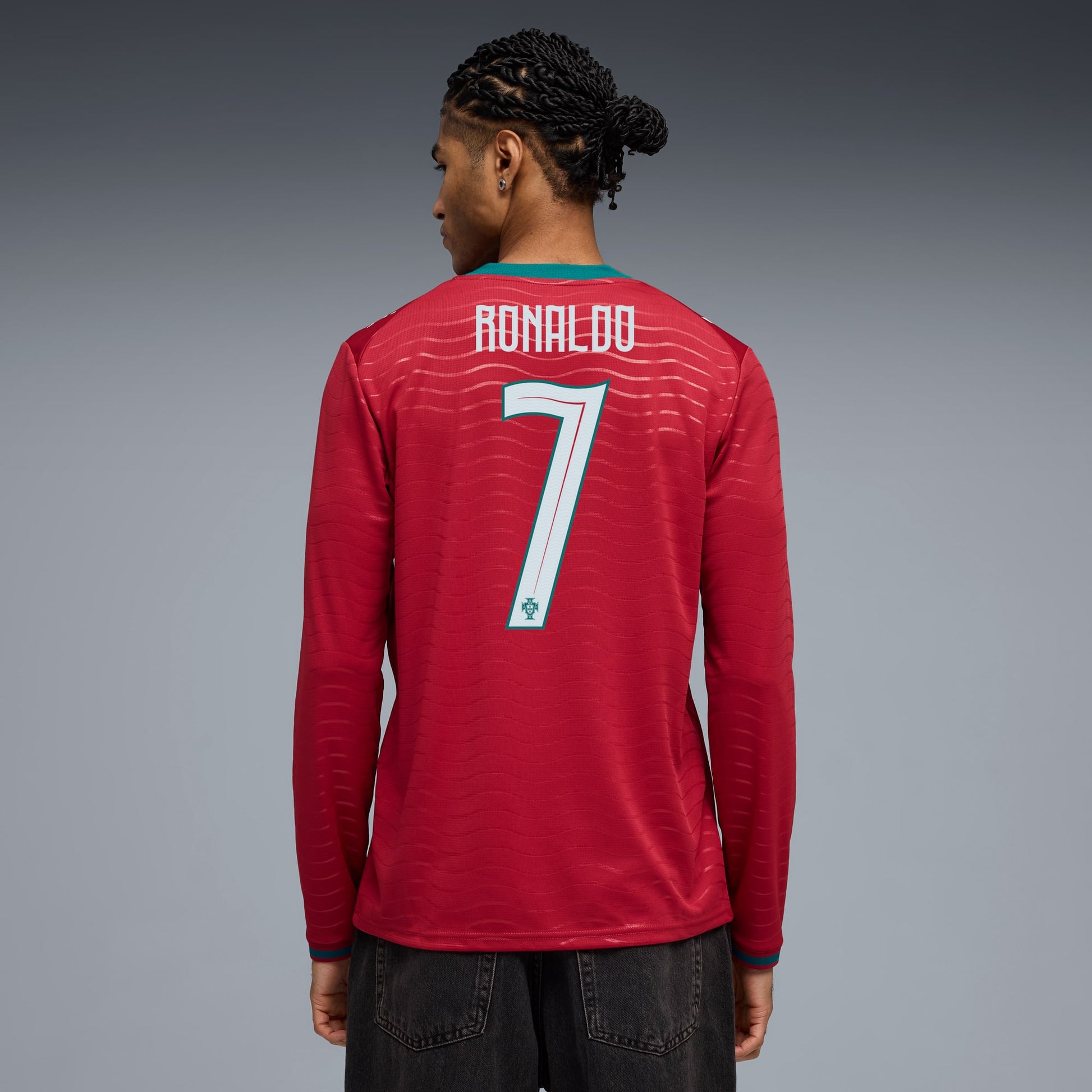 Person wearing a portugal 2026 long sleeve home stadium with ronaldo 7 printing back view