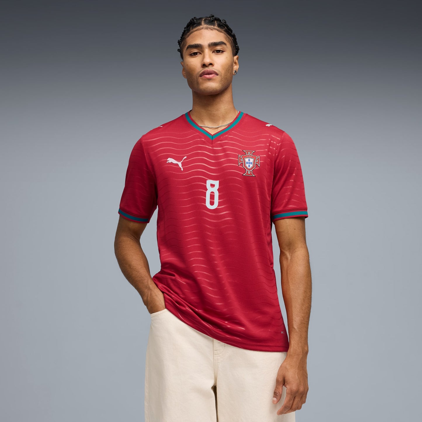 Person wearing a red Portugal 2026 World Cup home Stadium Replica Jersey with B. Fernandes #8 printing 