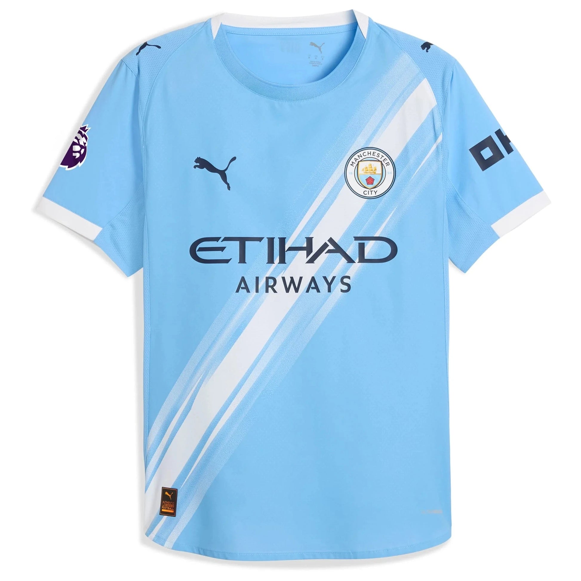 Flat lay of Manchester City 2025/26 home replica jersey front showing club crest and sky blue color