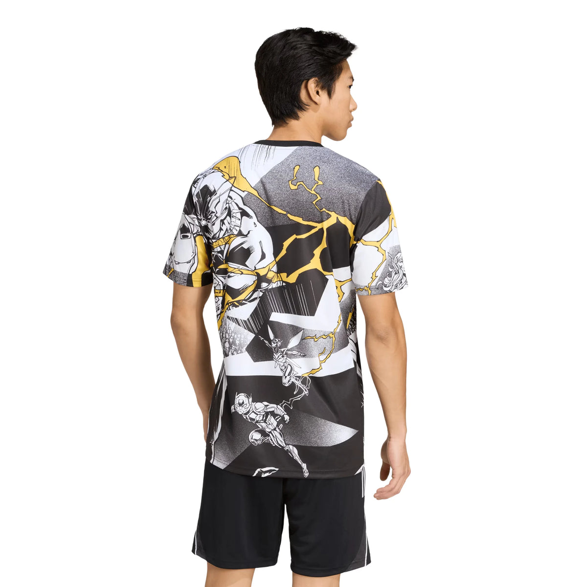 A man shown from the back wearing a short-sleeve athletic t-shirt with a black, white, and gray graphic print featuring gold lightning-bolt accents, paired with black athletic shorts, against a plain white background.