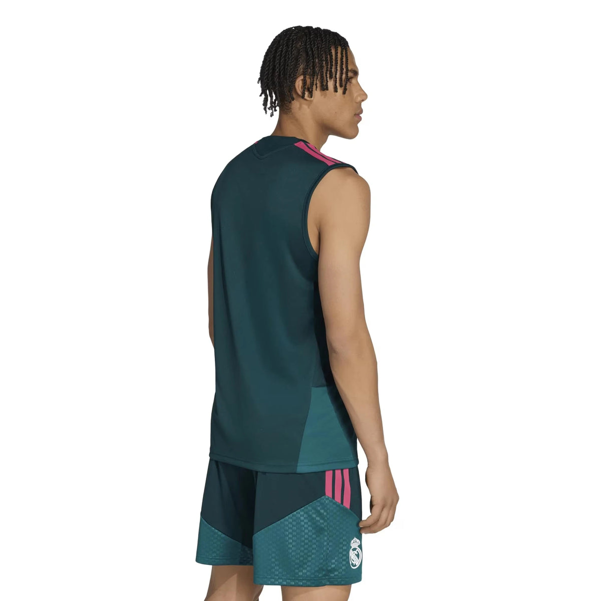 Person wearing a green sleeveless sports jersey and shorts with pink accents on a white background