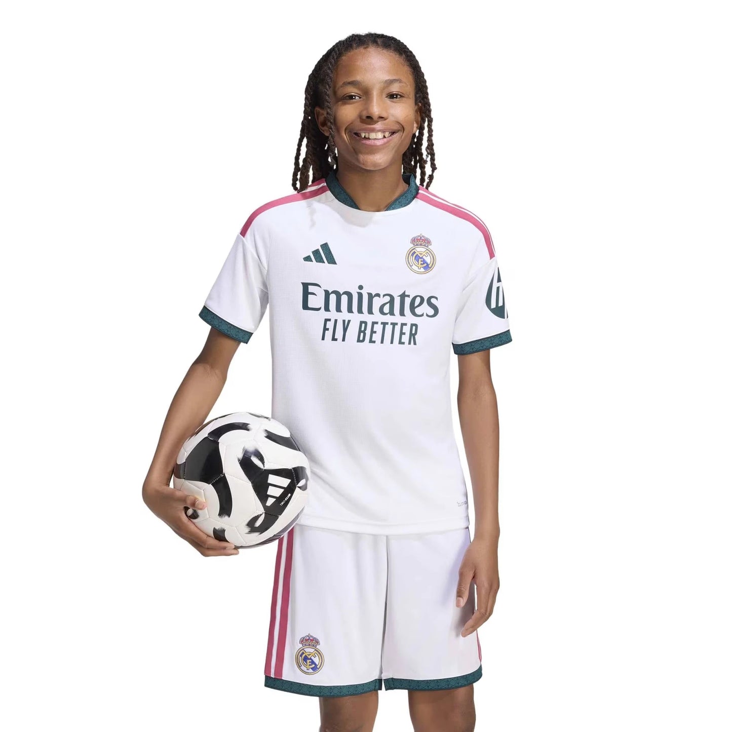 A Boy Wearing 2627 Real Madrid Home Set Kit With A Ball