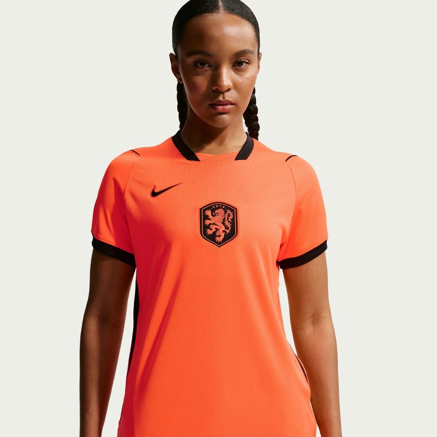 A girl wearing Women's Netherlands 2026 World Cup Home Stadium Replica Jersey